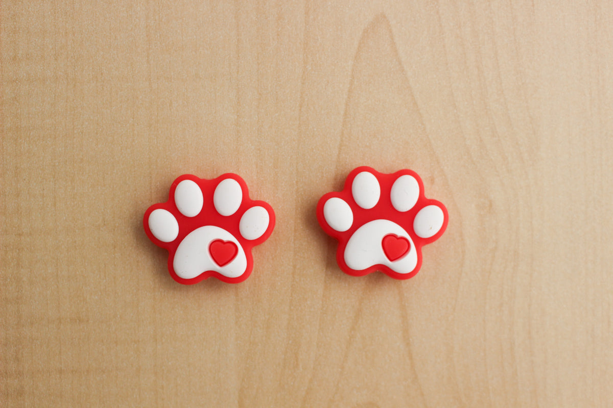Buttons And Bows Haberdashery Stitch Stoppers silicone paw prints red
